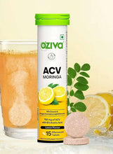 ACV Moringa effervescent tablet canister with green lid and lemon slices