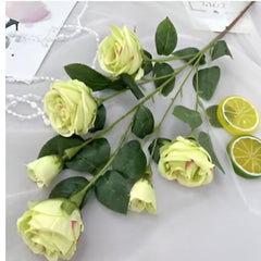 Pack of 2 fake rose flowers by Huitich in pale green with realistic leaves and stems