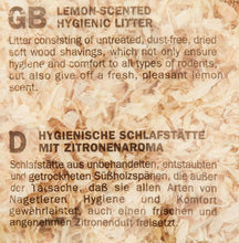 Lemon-scented hygienic litter text on wood shavings packaging