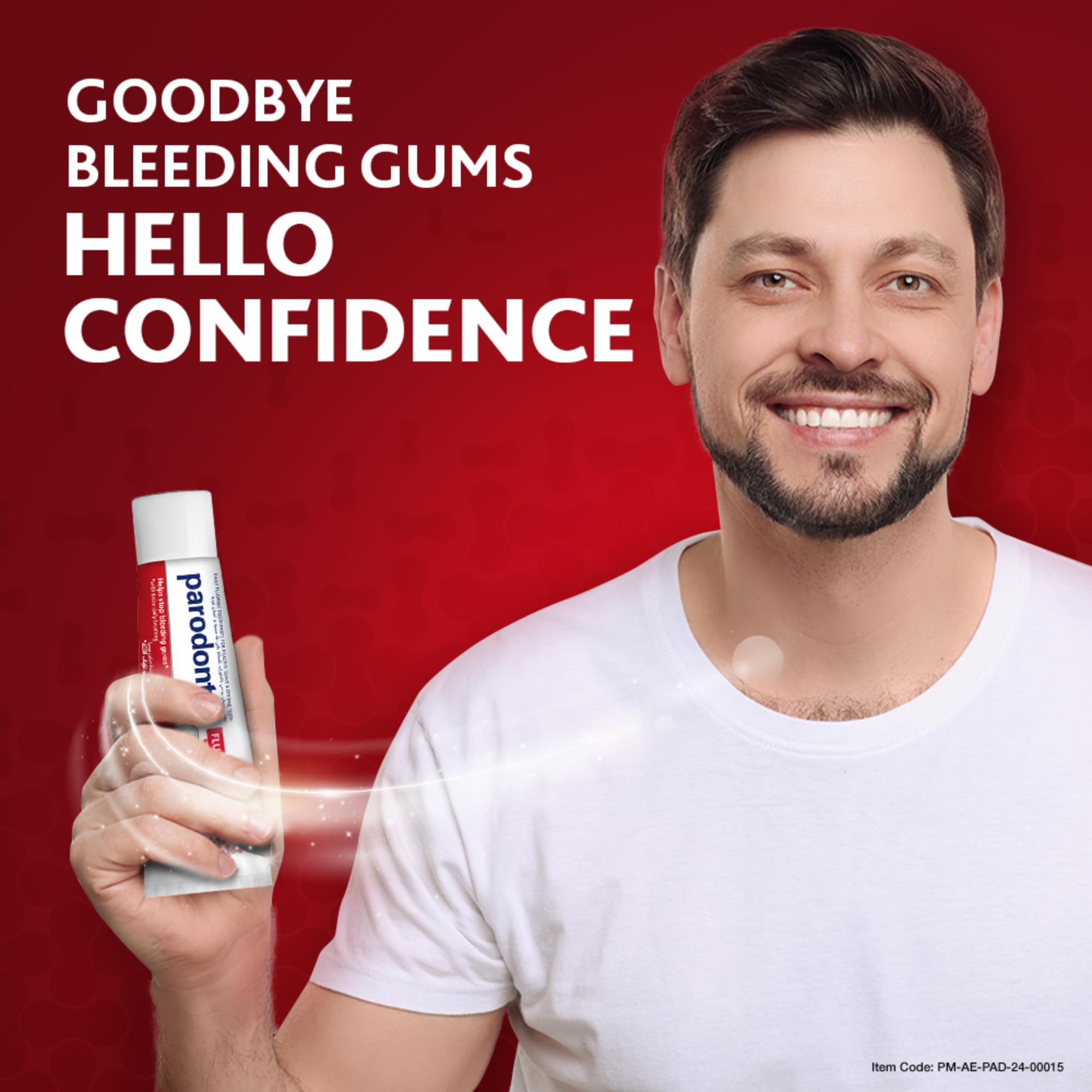 Smiling man holding Parodontax toothpaste fluoride 75ml tube on red background with text goodbye bleeding gums hello confidence