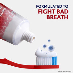 Parodontax toothpaste fluoride 75ml tube dispensing white and blue paste on red toothbrush formulated to fight bad breath