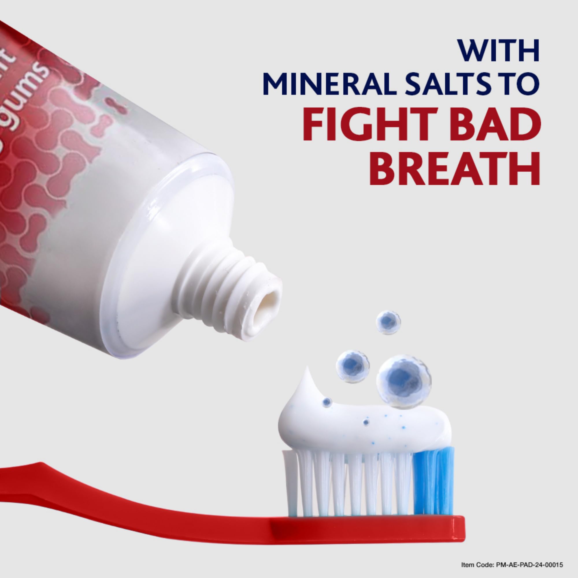 Parodontax toothpaste for bleeding gums tube dispensing white paste with blue specks onto red toothbrush with mineral salts