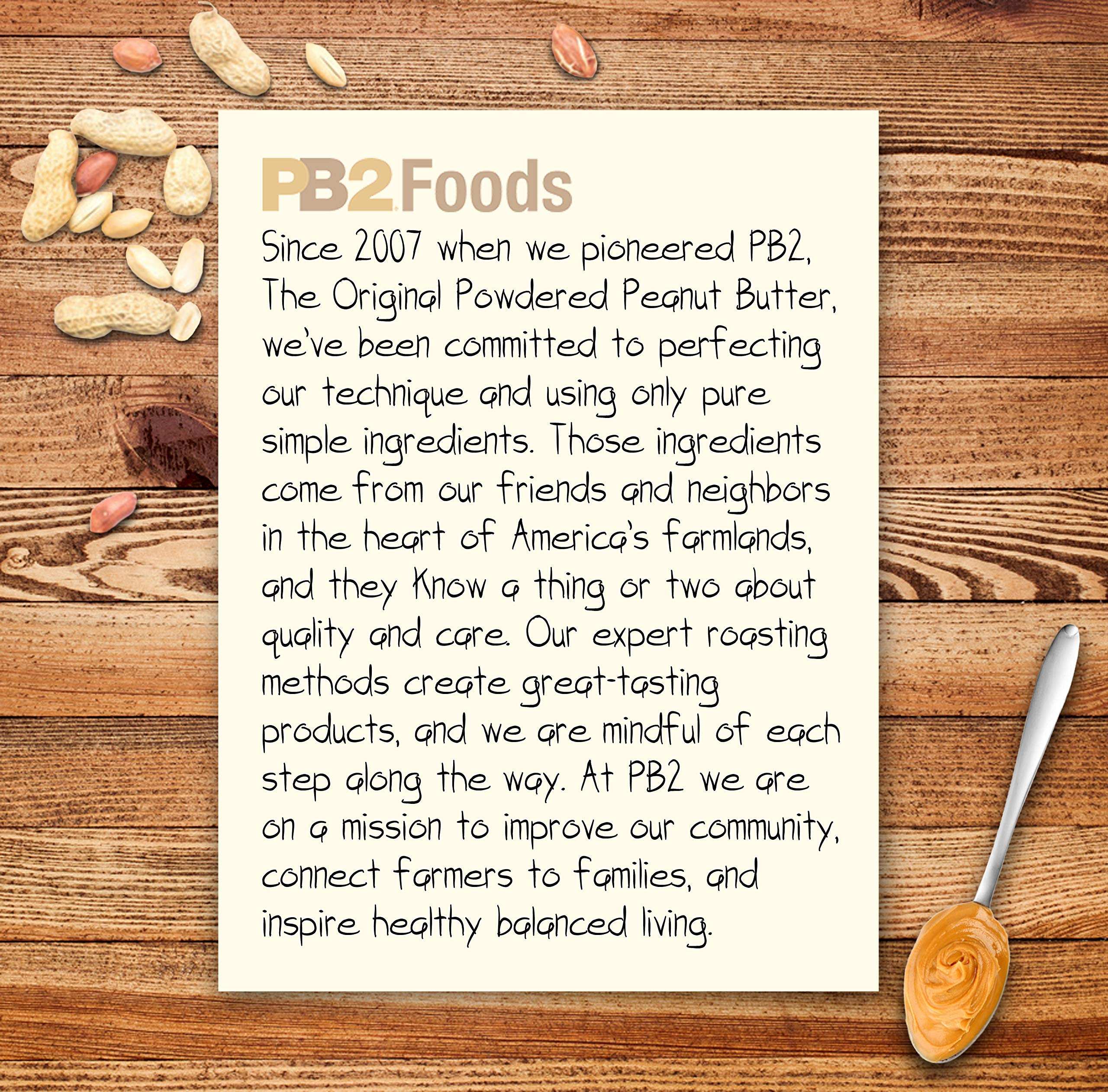 PB2 Foods product note on wooden board with scattered peanuts and spoon of peanut butter powdered peanut butter UAE