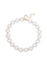 Pearl choker necklace with gold-tone links and small floral bead accents