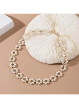 Pearl choker necklace with layered pearl strands and gold-tone clasp