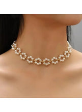 Pearl choker necklace with triple pearl-and-bead row design, gold-tone clasp
