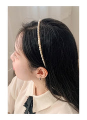 Huitich pearl hair accessory for kids worn on a girl with long dark hair and white blouse