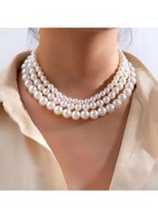 Huitich elegant triple strand pearl necklace worn on neck with cream blouse
