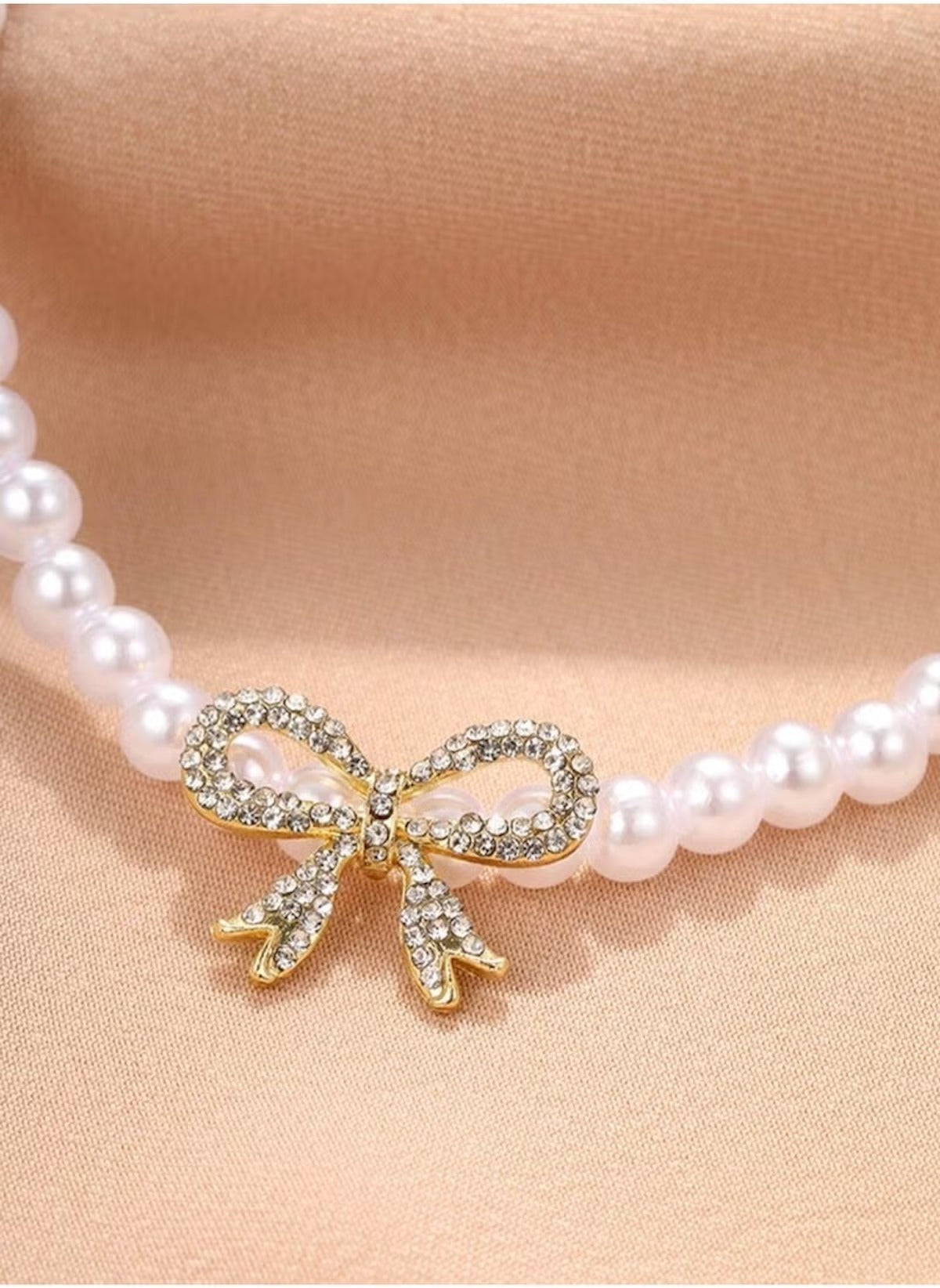 Huitich pearl necklace with bow pendant featuring white pearls and a gold-tone rhinestone bow charm