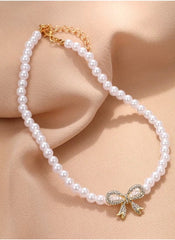 Huitich pearl necklace with bow pendant featuring white pearls and a gold rhinestone bow charm
