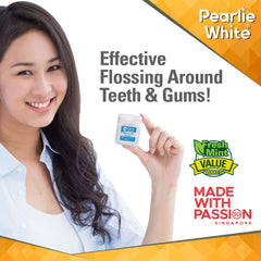 Smiling woman holding Pearlie White waxed mint dental floss container promoting effective flossing