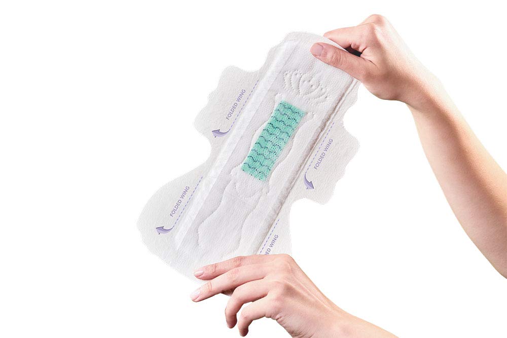 PECTIV ultra thin night sanitary pads held open showing wings and green absorbent core for overnight protection