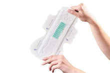 Long night sanitary pads with side guards, white pad with green absorbent strip