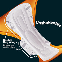 Close up of Whisper Ultra Night sanitary pads XXL white overnight pad with double hug wings and secure fit moon print