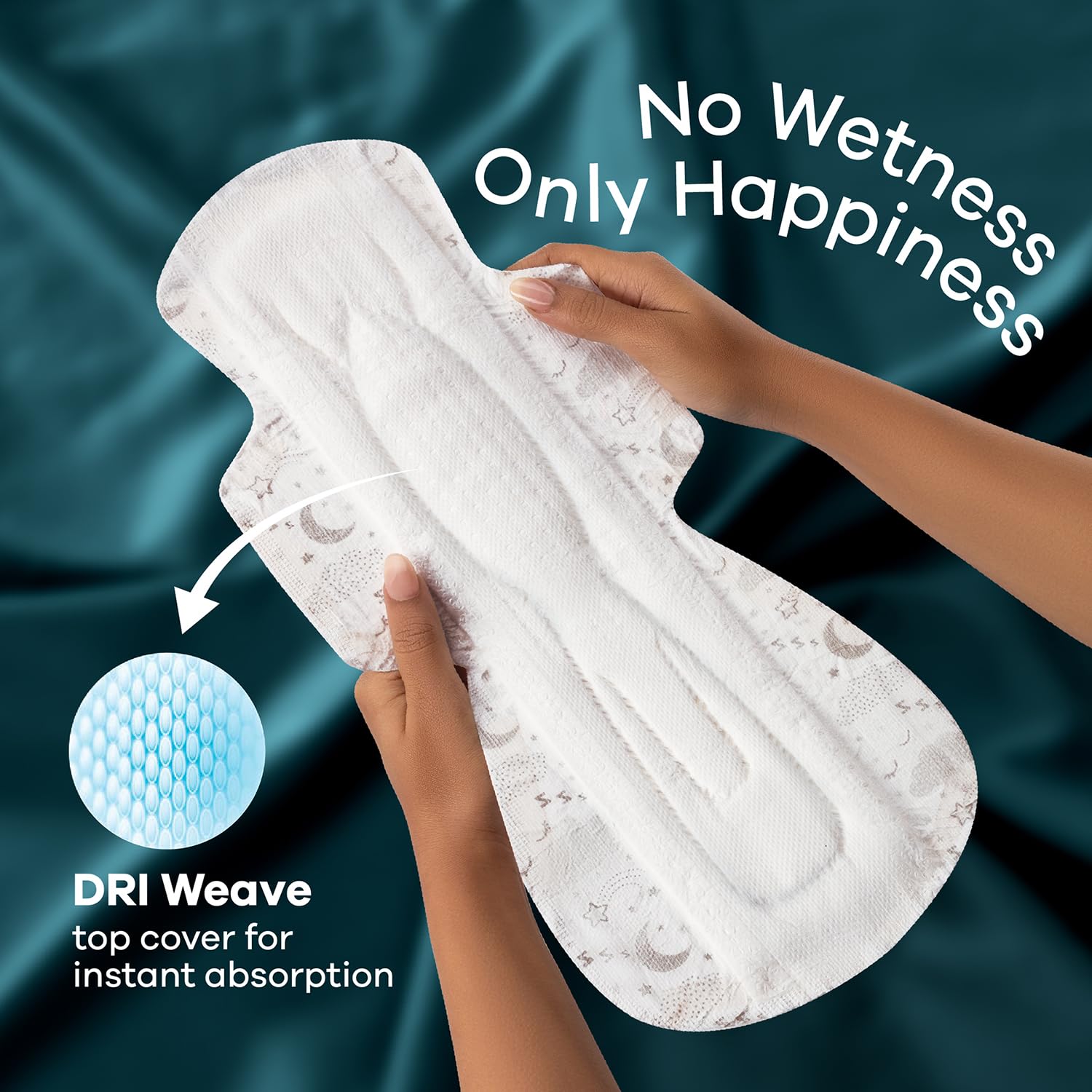 Hands holding Whisper Ultra Night sanitary pads XXL showing white absorbent pad with DRI Weave top cover and No Wetness slogan