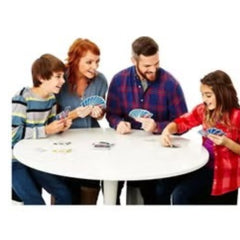 Family playing a card game around a table with Phase 10 rules and instructions from Huitich