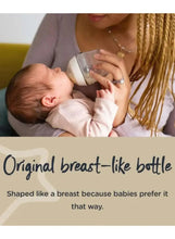 Original breast-like baby feeding bottle with teat, baby drinking