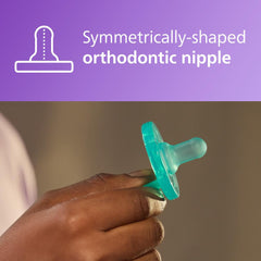 Hand holding teal Philips Avent Soothie pacifier 0-3 months with symmetrical orthodontic nipple design