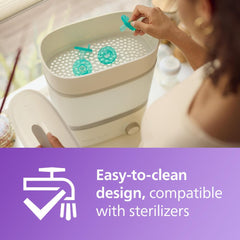 AVENT Philips Avent Soothie pacifier 0-3 months teal pacifiers in a sterilizer being placed by parent