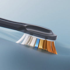Close up of Philips Sonicare Premium brush heads on a black handle with multicolor bristles