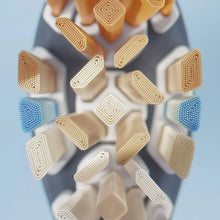 Sonicare brush head with blue and beige bristle arrays for cleaning