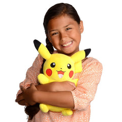 Girl smiling and hugging an 8 inch Pikachu stuffed animal plush toy by Huitich