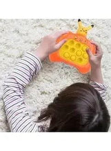 Orange Pikachu pop-it fidget toy in hands, yellow bubble surface