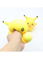 Hand squeezing a yellow Pikachu stress relief ball with another Pikachu ball in the background
