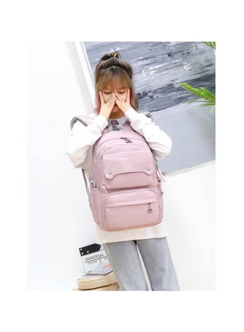 Girl wearing a pink and grey school backpack with multiple pockets and comfortable straps