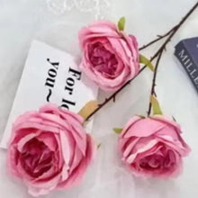 Pink artificial rose bouquet with three realistic blossoms on wire stems
