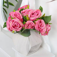 Pink artificial rose bouquet of silk flowers arranged in a modern white vase by Huitich