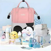 Pink diaper travel bag with “hello” print and cartoon mouse face, open-front pocket details.