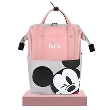 Pink diaper travel bag with “hello” lettering, cartoon mouse face front, and side straps.