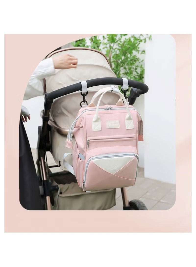 Huitich pink diaper backpack for moms attached to a stroller for easy access and portability