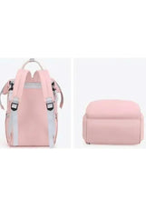 Pink baby travel backpack front and bottom views with carry handles and rounded base