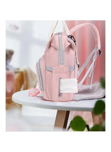 Light pink baby travel backpack with gray-trim zipper, front pouch, and adjustable straps