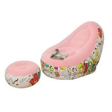 Pink inflatable lounge chair with colorful graphic base and matching round footrest