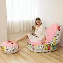 Pink inflatable lounge chair with graphic pattern and matching footrest, open upright