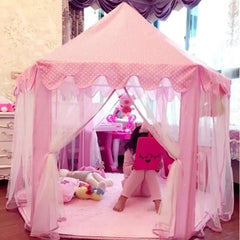 Pink princess tent for girls with sheer curtains and a child playing inside on a soft pink carpet