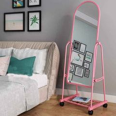 Huitich rotatable floor mirror with wheels in pink frame next to bed in modern bedroom