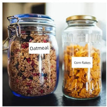 Label stickers on glass jars showing Oatmeal and Corn flakes