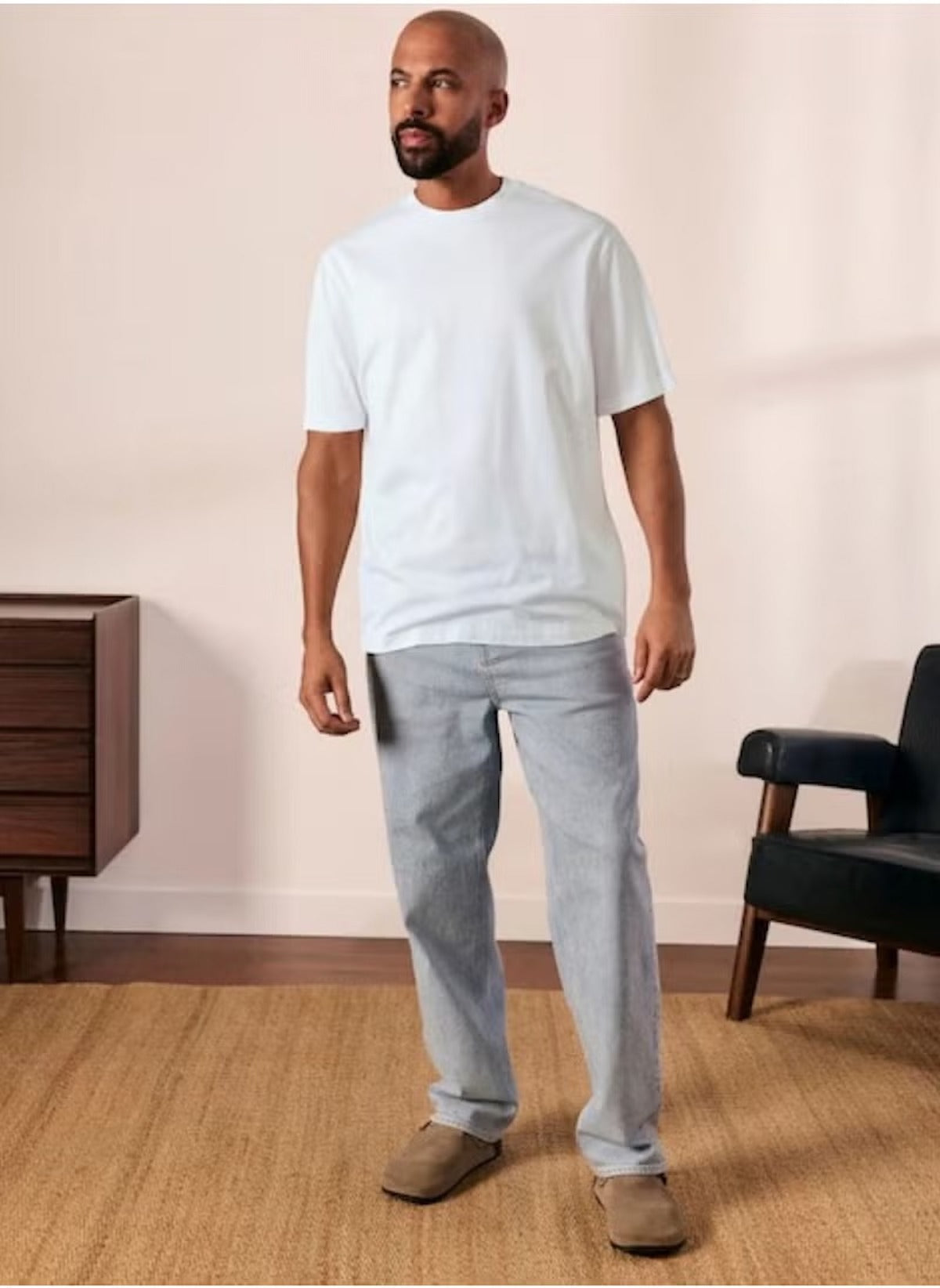 Man wearing plain white t shirt for men XL by Huitich paired with light gray pants and brown shoes
