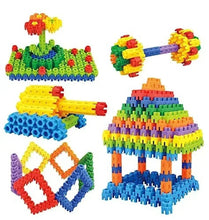 Colorful plastic brick construction set with built buildings and vehicle shapes