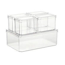 Clear plastic refrigerator organizer with two top compartments on a larger base bin, empty