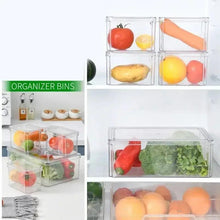 Stacked clear refrigerator organizer bins with multiple compartments and vegetables inside