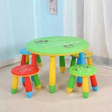 Kids study table set with round green top and four stools, colorful striped legs and seats