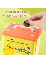 Yellow Pokémon coin bank with orange top, hand pressing slot cover.