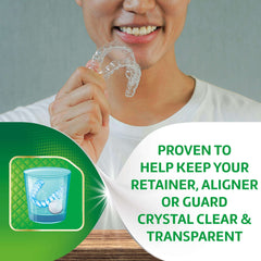 Person holding clear retainer by mouth with cup and tablet graphic and product text Polident 3 minute denture cleanser tablets