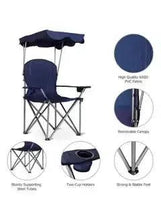 Portable folding beach chair with navy canopy and padded seat on X-frame