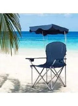 Folding beach chair with navy seat and back, dark canopy shelter, metal X-legs